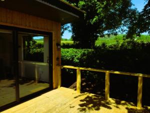 a porch of a house with a door open at An Garraí Mór in Omagh +14 photos