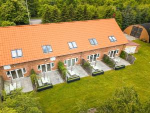 an overhead view of a house with an orange roof at Lustrup Farmhouse in Ribe