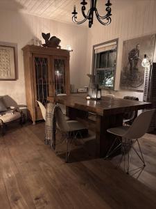 a dining room with a wooden table and chairs at Copeland House 4 Island Wall in Whitstable