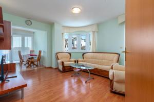 a living room with a couch and a table at Villa Ani in Trogir