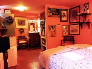 a bedroom with a painting on the wall at Gallery Basement in Villa Vravrona in Markopoulo