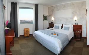 Postel nebo postele na pokoji v ubytování Hotel Medea + 37 fotografií