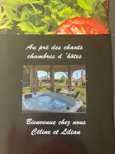 a picture of a hot tub in a garden at Au pré des chants in Saint-Philbert-des-Champs