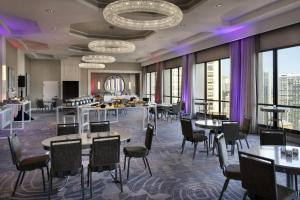 a dining room with tables and chairs and windows at San Francisco Marriott Union Square in San Francisco