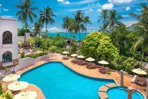an image of a pool at a resort with umbrellas at Sheraton Samui Resort in Chaweng Noi Beach