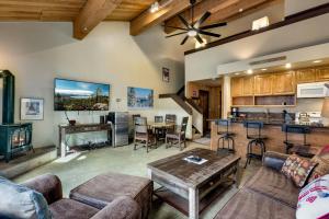 a living room with a couch and a table at Northstar Resort by Vail Resorts in Truckee
