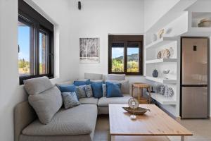 a living room with a couch and a table at Ιπποθόη in Meganisi