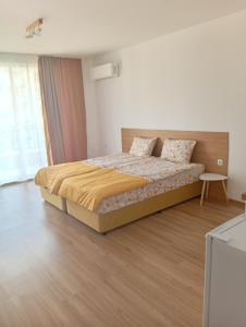 a bedroom with a bed in a room at Kristan in Sveti Vlas