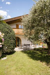 a group of benches in front of a house at Villa in Cermes