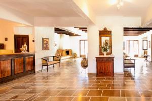 a large living room with a table and chairs at Stellina Hotel in Skiathos