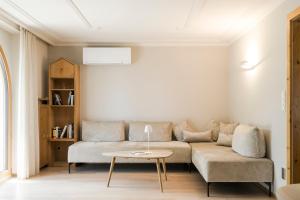 a living room with a couch and a table at Villa in Cermes
