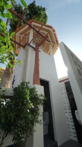 a church with a cross on the side of it at Pukawa Hotel & Residence in Chaloklum