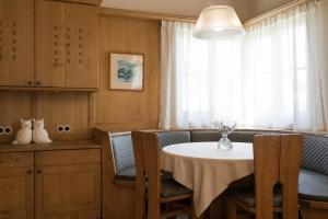 a dining room with a table and chairs and a window at Villa in Cermes
