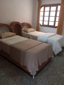 two beds sitting next to each other in a room at Amsa aqua villa in Tétouan