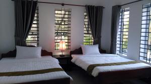 Tempat tidur dalam kamar di Anou Home - Guesthouse