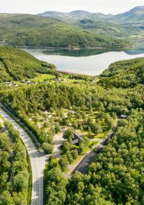 an aerial view of a road and a lake at Fauske Camping & Motel in Fauske