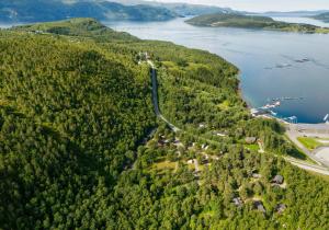 an aerial view of a road next to a lake at Fauske Camping & Motel in Fauske