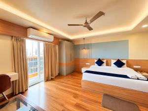 a bedroom with a large bed and a large window at Durene Beach Resort - New Premium Resort In Baliapanda - Restaurant - Beach - Parking in Puri +15 photos