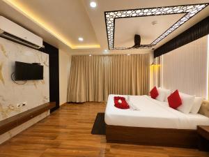 a hotel room with a large bed and a tv at Durene Beach Resort - New Premium Resort In Baliapanda - Restaurant - Beach - Parking in Puri