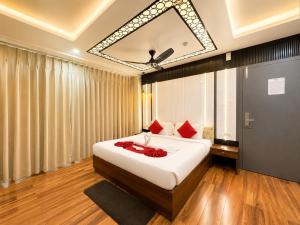 a bedroom with a large bed with red pillows at Durene Beach Resort - New Premium Resort In Baliapanda - Restaurant - Beach - Parking in Puri