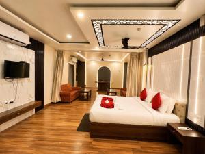 a hotel room with a bed and a television at Durene Beach Resort - New Premium Resort In Baliapanda - Restaurant - Beach - Parking in Puri