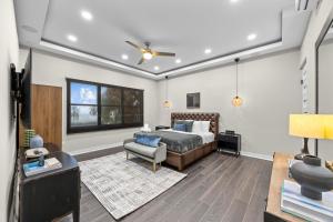 a bedroom with a bed and a couch and a chair at Casa Lotus in San Juan