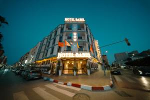 a building on a city street with a traffic light at Hotel BouBabel in Nador