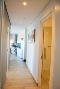 a hallway leading to a kitchen in a apartment at Apartment 24 in Durban +4 photos