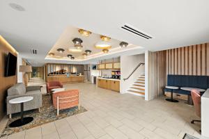 a lobby with chairs and tables and a living room at Hampton Inn San Simeon Cambria in San Simeon