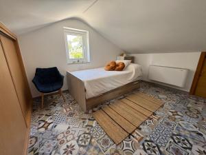 a bedroom with a bed with a pile of bread on it at Carimar, a mirada da ría in Boiro +17 photos