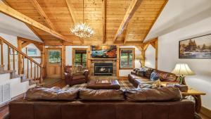 a living room with a couch and a fireplace at Hillside Hideaway in Sevierville