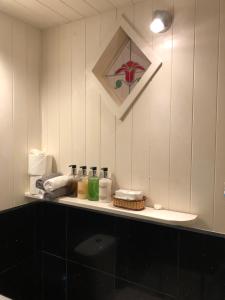 a bathroom counter with items on top of it at Samphire in Padstow