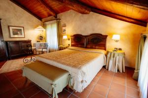 a bedroom with a large bed in a room at Romantic Hotel Furno in San Francesco al Campo +56 photos