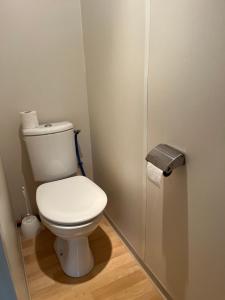 a bathroom with a white toilet in a stall at SAS Le Bataillet in Montégut +8 photos