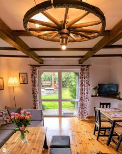 a living room with a couch and a table at U Anuli in AdamÃ³w +22 photos
