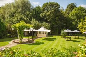 a garden with a gazebo and picnic tables at Fox & Hounds Country Hotel in Chulmleigh +57 photos
