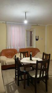 a living room with a table and chairs and a couch at Vrela vacation in Vrela