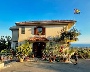 a man standing in front of a house at Pupi Catania Etna Farm in Catania