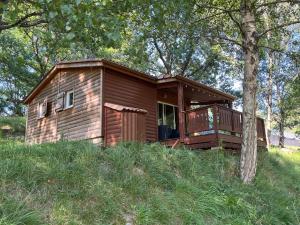 a small house sitting on top of a hill at SAS Le Bataillet in Montégut