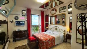 a bedroom with a bed and a window and a mirror at Pupi Catania Etna Farm in Catania