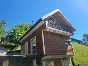 a house with a balcony on top of it at Забрус насолоди in Kosiv +19 photos