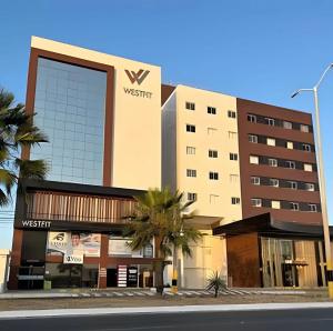 a building with a sign on the side of it at WestFit - Barreto - 709 in Mossoró