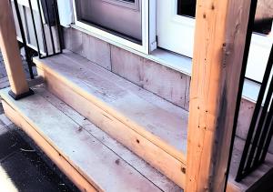 a wooden step leading up to a window at Peterborough Zen Retreat in Peterborough