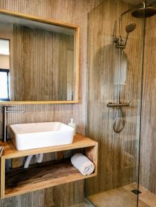 a bathroom with a sink and a shower at Nomads Kodjoviakopé in Lomé +31 photos