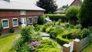 a garden in front of a house at Altes Landhaus in Behrendorf