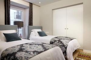 Posteľ alebo postele v izbe v ubytovaní Hika Mika Apartment by FeelFree Rentals