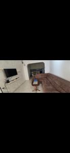a room with a table and a bench in it at Apartmani Seki in Bar