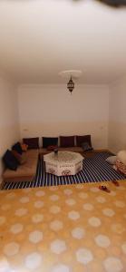 a living room with a couch and a table at mirleft in Mirleft