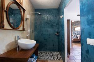 a bathroom with a sink and a mirror at Tabaiba Suites Lanzarote - Macaronesia Homes in La Asomada +58 photos
