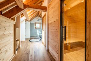 a wooden hallway with a door in a house at Malago in Le Monêtier-les-Bains +19 photos